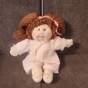 Charming Pink Doll with Curly Brown Hair
